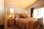 Master bedroom has a king bed and a deck to go out and enjoy the mountain views.   